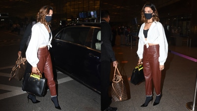 Deepika Padukone stepped out in brown faux leather pants and a white blouse to catch a flight. (Varinder Chawla) Deepika Padukone stepped out in brown faux leather pants and a white blouse to catch a flight. (Varinder Chawla)