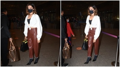 The highlight of Deepika's look was the glam pointed black pumps she wore with black stockings. They ramped up her attire exponentially and made her airport look runway-worthy. (HT Photo/Varinder Chawla) The highlight of Deepika's look was the glam pointed black pumps she wore with black stockings. They ramped up her attire exponentially and made her airport look runway-worthy. (HT Photo/Varinder Chawla)