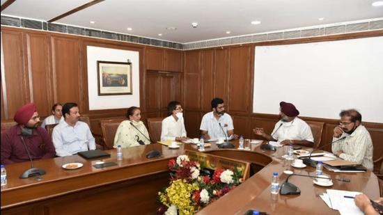 A nine-member delegation of AUCT during a meeting with higher education minister Pargat Singh and higher education secretary Krishan Kumar in Chandigarh on Wednesday. (HT Photo)