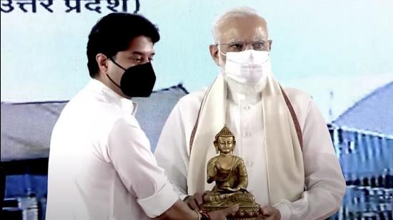 Civil aviation minister Jyotiraditya Scindia felicitates Prime Minister Narendra Modi during the inauguration of Kushinagar International Airport. (PTI Photo)