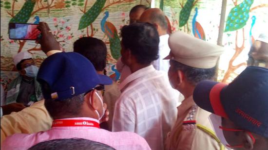 Locals and police meet near the site of the incident in Osmanabad on Wednesday. A crowd had gathered at a junction in Osmanabad on Tuesday in response to a social media post made against Mughal Emperor Aurangzeb. (Laxman Narnale/ht photo)