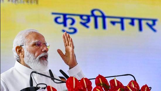 Prime Minister Narendra Modi addressing a gathering after the inauguration of the Kushinagar international airport in Uttar Pradesh on Wednesday. (PTI Photo)