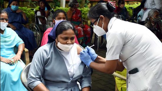 A beneficiary receives a dose of the COVID-19 vaccine at Chachaier Home, in Ranchi. (ANI)