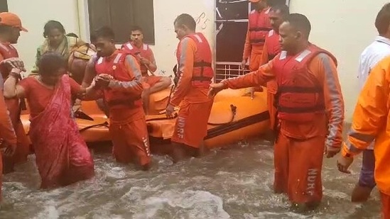 An NDRF team carries out rescue operations at several waterlogged areas in Rudrapur, Uttarakhand.(ANI)