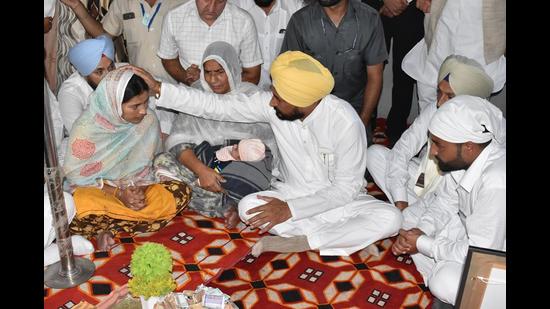 Punjab CM Charanjit Singh Channi with the family of slain soldier Naik Mandeep Singh at Chatha Seera village in Gurdaspur district on Wednesday.