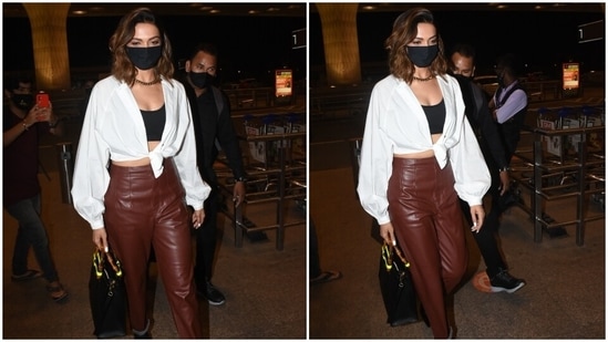 Deepika carried a Gucci black top handle bag with the attire. A black face mask made sure she stayed protected amid the coronavirus pandemic. For accessories, Deepika opted for a chunky gold necklace and a ring.(HT Photo/Varinder Chawla)