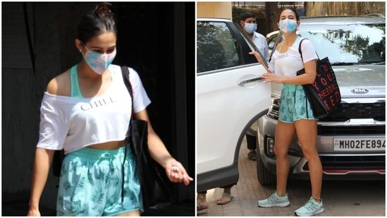 On the other hand, Sara was clicked outside her Pilates studio in a white half-sleeved crop top and tropical printed mint green shorts. She rounded off her attire with a mint green sports bra.(HT Photo/Varinder Chawla)