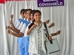 Nursing staff of the M S Ramaiah hospital pose holding vaccines and syringes to celebrate the 1 billion Covid-19 vaccine dose milestone, in Bengaluru, Thursday. (PTI) Nursing staff of the M S Ramaiah hospital pose holding vaccines and syringes to celebrate the 1 billion Covid-19 vaccine dose milestone, in Bengaluru, Thursday. (PTI)