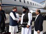 Afghanistan's acting Foreign Minister Amir Khan Muttaqi (2R) receiving Pakistan's Foreign Minister Shah Mahmood Qureshi (3L) upon his arrival at the airport in Kabul. (AFP) Afghanistan's acting Foreign Minister Amir Khan Muttaqi (2R) receiving Pakistan's Foreign Minister Shah Mahmood Qureshi (3L) upon his arrival at the airport in Kabul. (AFP)