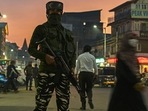 A security personnel stands guard along a street ahead of the visit of Union home minister Amit Shah, in Srinagar on October 20, 2021.(AFP) A security personnel stands guard along a street ahead of the visit of Union home minister Amit Shah, in Srinagar on October 20, 2021.(AFP)