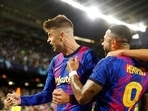 Barcelona's Gerard Pique, right, celebrates with his teammate Memphis Depay after scoring his side's first goal during a Champions League group E soccer match between F.C. Barcelona and Dinamo Kyiv at Camp Nou stadium in Barcelona, Spain, Wednesday, Oct. 20, 2021. (AP Photo/Joan Monfort)(AP) Barcelona's Gerard Pique, right, celebrates with his teammate Memphis Depay after scoring his side's first goal during a Champions League group E soccer match between F.C. Barcelona and Dinamo Kyiv at Camp Nou stadium in Barcelona, Spain, Wednesday, Oct. 20, 2021. (AP Photo/Joan Monfort)(AP)