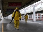 Servicemen of Russia's emergencies ministry wearing protective gear disinfect Moscow's Leningradsky railway station on October 19, 2021,&nbsp;
