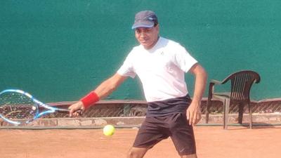 A player in action during the International Tennis Federation Seniors Ranking Championship at the Roots Tennis Academy in Zirakpur on Thursday. (HT Photo)