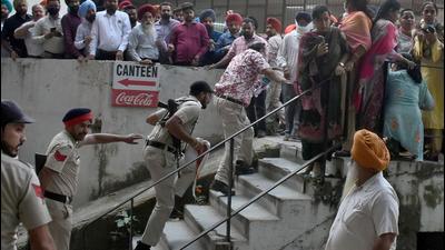 Members of a group of Sikh hardliners chased the Congress leader after he allegedly hurt their religious sentiments; the incident happened outside police commissioner office in Ludhiana. (Gurpreet Singh/HT)