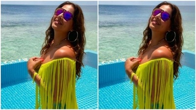 In a neon green cropped top, Bipasha posed by the pool. (Instagram/@bipashabasu) In a neon green cropped top, Bipasha posed by the pool. (Instagram/@bipashabasu)