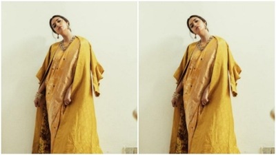 The saree is printed in maroon floral motifs. Keerthy teamed it with a printed oversized blazer as she posed in an indoor setup. (Instagram/@keerthysureshofficial) The saree is printed in maroon floral motifs. Keerthy teamed it with a printed oversized blazer as she posed in an indoor setup. (Instagram/@keerthysureshofficial)