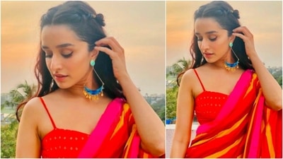Shraddha Kapoor teamed the bright red, orange, yellow and pink saree with a red spaghetti strap blouse. (Instagram/@shraddhakapoor)