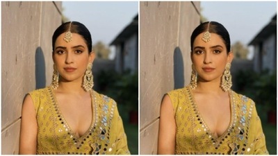 In golden jewellery from the house of Kohar by Kanika, Sanya accessorised her look for the day perfectly. Sanya teamed the sleeveless yellow blouse with a long flowy skirt of the same colour. (Instagram/@sanyamalhotra_) In golden jewellery from the house of Kohar by Kanika, Sanya accessorised her look for the day perfectly. Sanya teamed the sleeveless yellow blouse with a long flowy skirt of the same colour. (Instagram/@sanyamalhotra_)