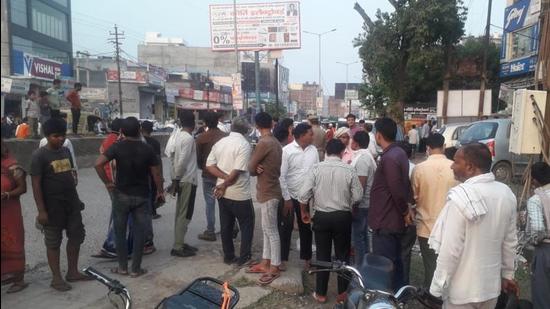 Locals gathered at the spot in Greater Noida where the man allegedly shot the woman. (Sourced)