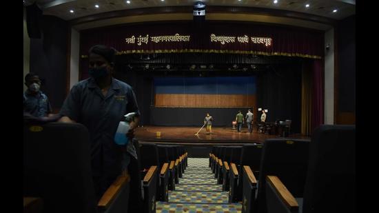 Navi Mumbai civic officials sanitise the Vishnudas Bhave auditorium in Vashi, which is set to reopen on Friday. (BACHCHAN KUMAR/HT FILE PHOTO)