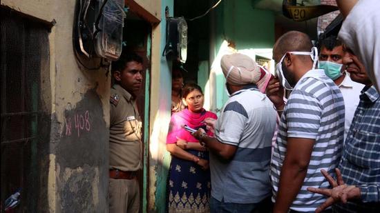 Police investigating the murder at Hallomajra in Chandigarh on Thursday. (Ravi Kumar/HT)