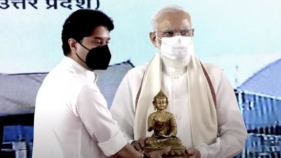 Civil aviation minister Jyotiraditya Scindia felicitates Prime Minister Narendra Modi during the inauguration of Kushinagar International Airport. (PTI)