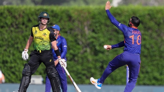 Dubai: India's captain Virat Kohli, right, bowls as Australia's Steven Smith watches during the Cricket Twenty20 World Cup warm-up match between India and Australia in Dubai, UAE, Wednesday, Oct. 20, 2021.AP/PTI(AP10_20_2021_000139B)(AP)