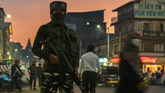 A security personnel stands guard along a street ahead of the visit of Union home minister Amit Shah, in Srinagar on October 20, 2021. (AFP)