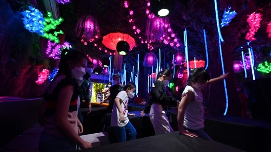 Children take part in a game from the Netflix series Squid Game at a cafe in Jakarta.(AFP)