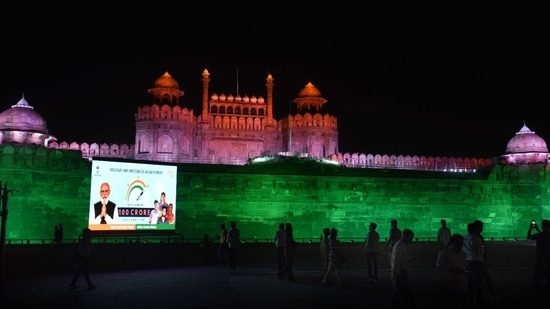 Red Fort in Delhi illuminated by the Archaeological survey of India on administration of 100 Crore Covid 19 vaccine doses.(HT Photo)