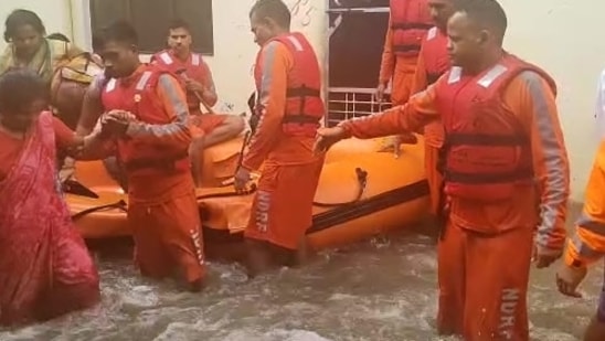 An NDRF team carries out rescue operations at several waterlogged areas in Rudrapur, Uttarakhand.(ANI Photo)