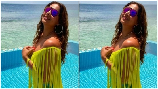 In a neon green cropped top, Bipasha posed by the pool.(Instagram/@bipashabasu)