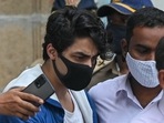 Aryan Khan, son of Bollywood actor Shah Rukh Khan, is escorted to court by Narcotics Control Bureau (NCB) officials for a bail plea hearing. Aryan Khan, son of Bollywood actor Shah Rukh Khan, is escorted to court by Narcotics Control Bureau (NCB) officials for a bail plea hearing.