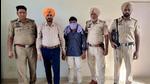 One of the drug peddlers in the STF custody in Ludhiana on Friday. (Harsimar Pal Singh/Hindustan Times) One of the drug peddlers in the STF custody in Ludhiana on Friday. (Harsimar Pal Singh/Hindustan Times)