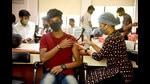 College students get their vaccination in a special drive for colleges by Navi Mumbai Municipal Corporation in Vashi on Friday. (BACHCHAN KUMAR/HT PHOTO) College students get their vaccination in a special drive for colleges by Navi Mumbai Municipal Corporation in Vashi on Friday. (BACHCHAN KUMAR/HT PHOTO)