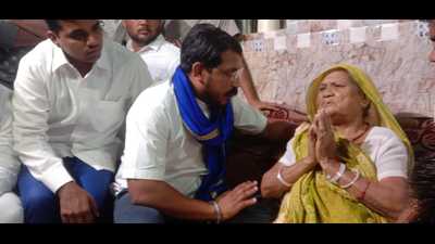 Azad Samaj Party chief Chandra Shekhar Azad meeting family members of a man killed in police custody in Agra. (HT Photo)