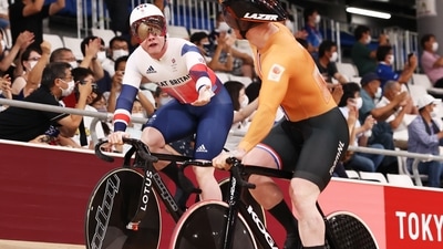 Tokyo 2020 Olympics - Cycling - Track - Men's Team Sprint - Gold Final - Izu Velodrome, Shizuoka, Japan - August 3, 2021. A cyclist from Team Netherlands celebrates after winning gold with a cyclist from Team Great Britain who wins silver. REUTERS/Kacper Pempel (REUTERS)