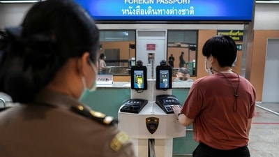 An airport staff practices departure protocols during a readiness inspection in preparation for the country's reopening on November 1, at Don Mueang International Airport in Bangkok. (Reuters Photo)