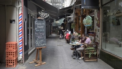 A "Freedom Friday" sign at the entrance to an alley way in Melbourne, Australia. (Bloomberg) A "Freedom Friday" sign at the entrance to an alley way in Melbourne, Australia. (Bloomberg)