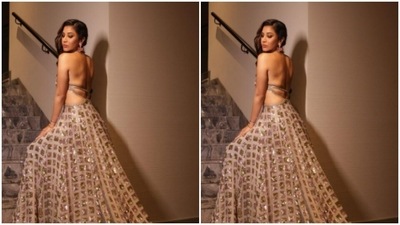 The gown came with a backless tie-back detail and a flowy skirt. (Instagram/@sophiechoudry)