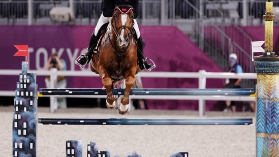 Tokyo 2020 Olympics - Equestrian - Jumping - Individual - Qualification - Equestrian Park - Tokyo, Japan - August 3, 2021. Zhang Xingjia of China on his horse For Passion D Ive Z competes. REUTERS/Alkis Konstantinidis(REUTERS)
