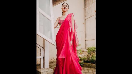 Ananya Panday’s look in a dreamy ruffled fuchsia saree with an embroidered blouse is perfect to replicate for a puja (Photos: Instagram)