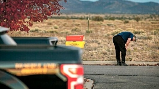 A distraught Alec Baldwin lingers in the parking lot outside the Santa Fe County Sheriff's Office in Santa Fe, N.M., after he was questioned about a shooting on the set of the film Rust on the outskirts of Santa Fe, Thursday.(AP)