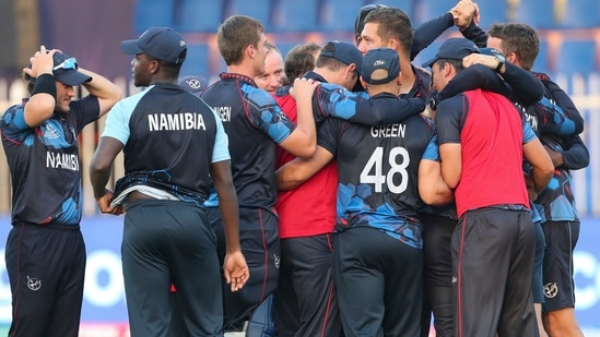 Nambian players celebrates after defeating Ireland by eight wickets in their Cricket Twenty20 World Cup first round match in Sharjah, UAE, Friday, Oct. 22, 2021.(AP)
