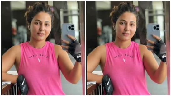 Hina posed for a phone selfie in a pink top and a grey pair of gym trousers.(Instagram/@realhinakhan)