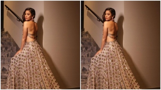 The gown came with a backless tie-back detail and a flowy skirt.(Instagram/@sophiechoudry)