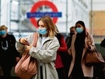 A commuter walks out of a underground train station in London. AFP