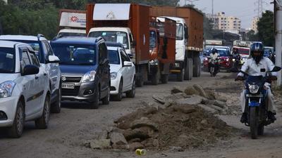 Potholes on the Golf Course Extension Road are among the road repairs to be undertaken by Gurugram civic agencies. (Vipin Kumar /HT PHOTO) Potholes on the Golf Course Extension Road are among the road repairs to be undertaken by Gurugram civic agencies. (Vipin Kumar /HT PHOTO)