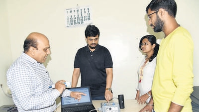 iCardin founder Sameer More (second from left) and his team at their headquarters in Pune. (HT PHOTO) iCardin founder Sameer More (second from left) and his team at their headquarters in Pune. (HT PHOTO)