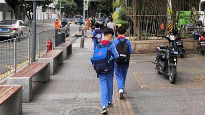 Children leave a school in Shekou area of Shenzhen, Guangdong province. China has passed a new law to cut down on students’ homework and off-school tutoring, seeking to strike a balance between academics, rest and physical education. (REUTERS) Children leave a school in Shekou area of Shenzhen, Guangdong province. China has passed a new law to cut down on students’ homework and off-school tutoring, seeking to strike a balance between academics, rest and physical education. (REUTERS)